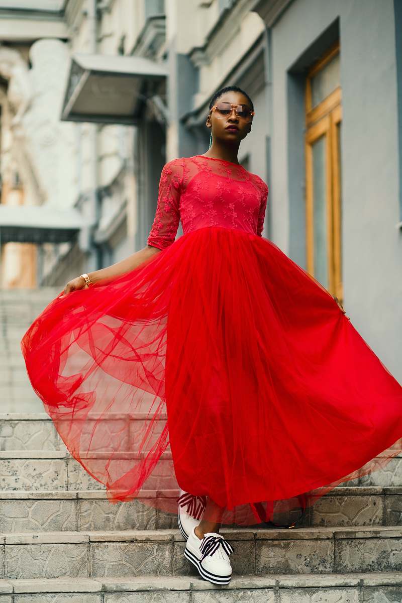 apparel woman wearing red dress walking in stairs clothing