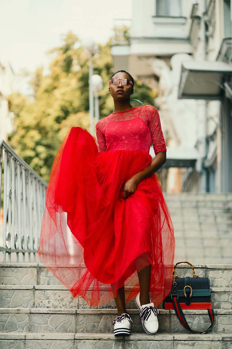 clothing woman wearing red half-sleeved dress standing on stair apparel