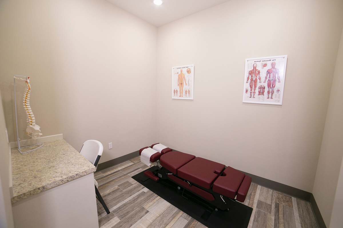 indoors red leather padded massage bed inside building interior design