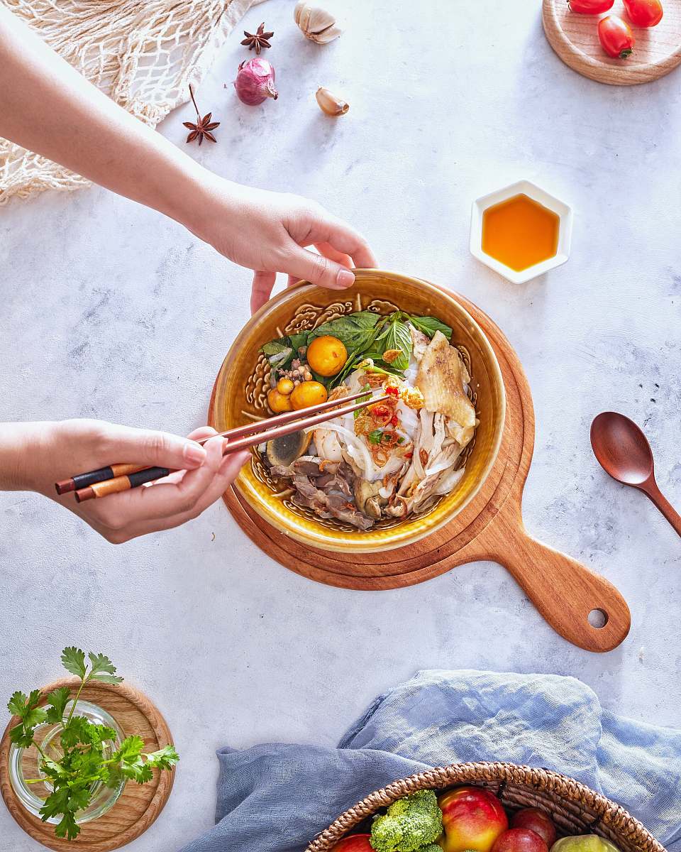 bowl person preparing soup in brown ceramic bowl human