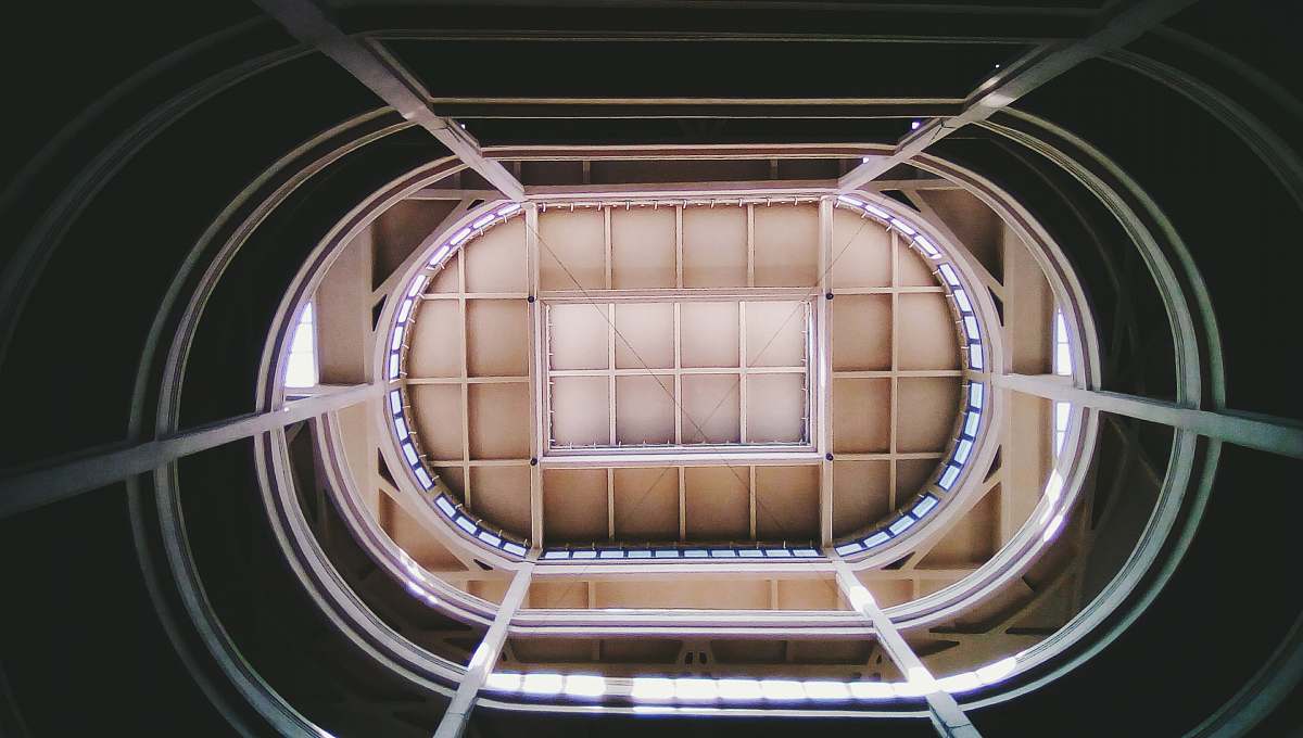 staircase low-angle photography of building banister