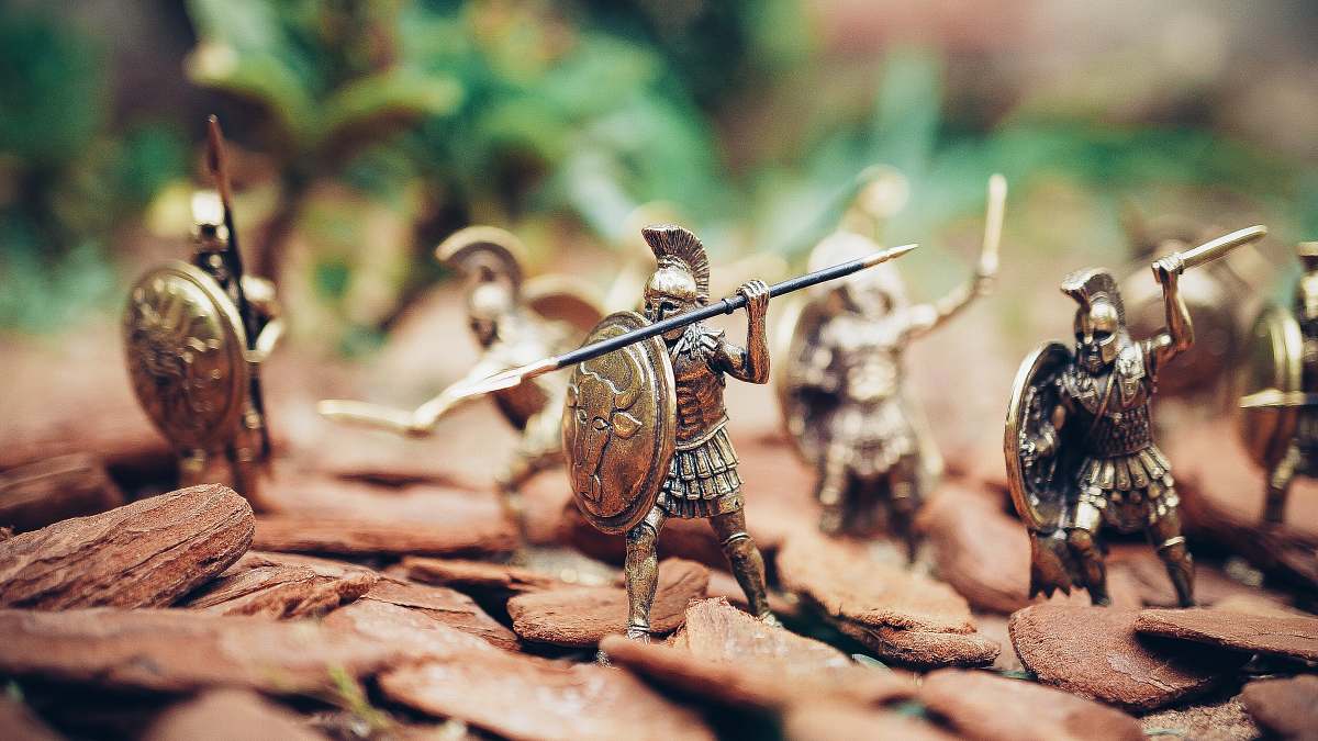toy grey metal knights figurines during daytime bronze
