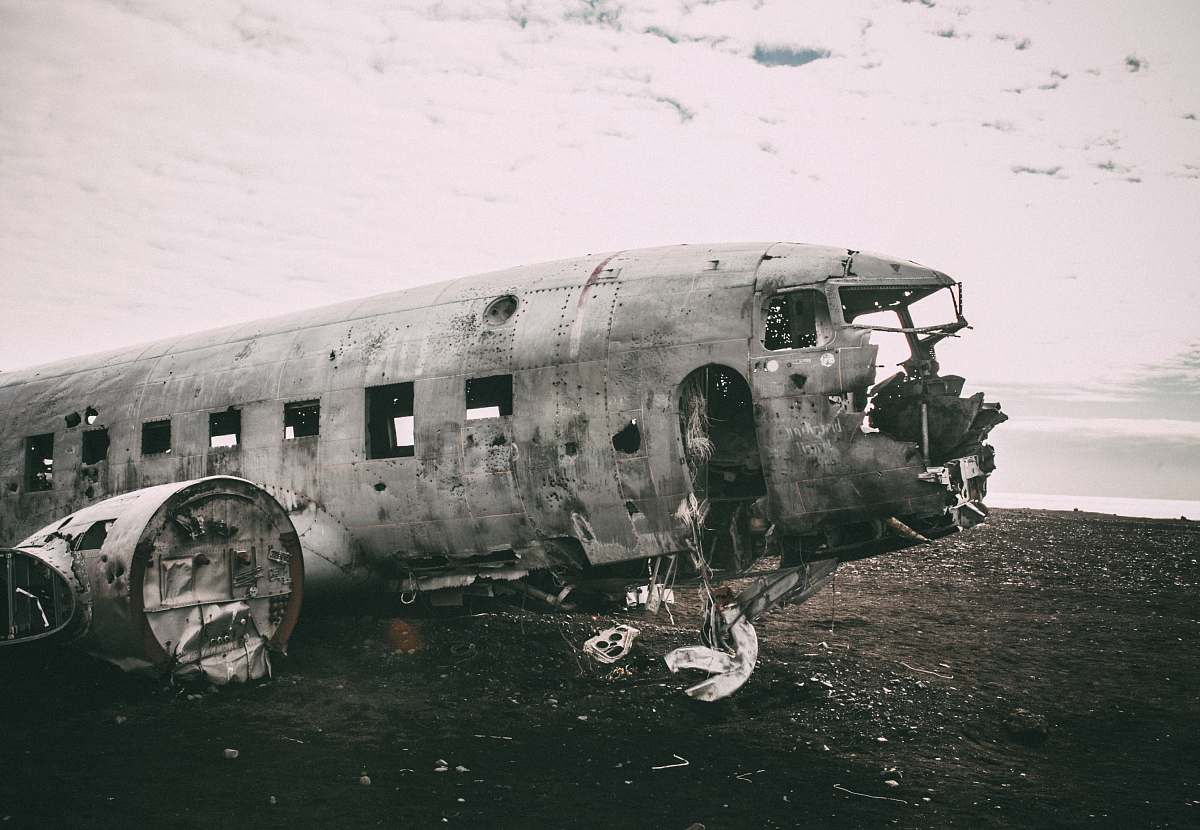 transportation grayscale photo of abandoned airliner in open field army