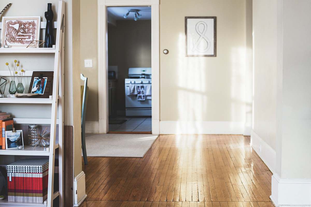 interior photo of white painted room hardwood