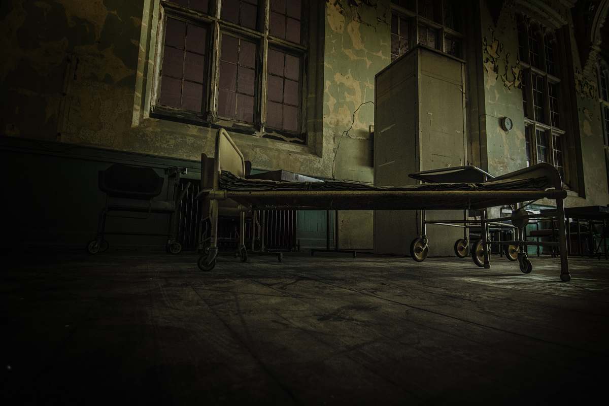window hospital bed on concrete pavement bed