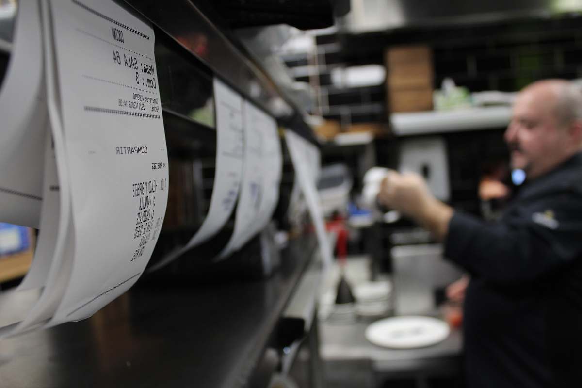 person chef in the kitchen area grey