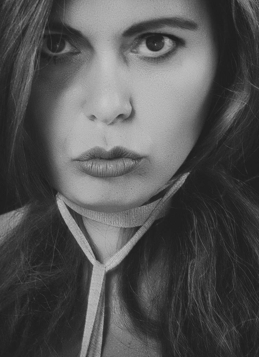 face closeup photo of woman's face black-and-white