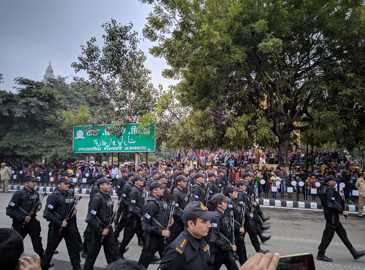 person group of men walking at the parade apparel