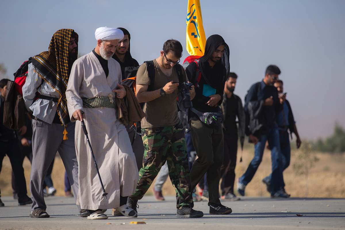 person group of people walking on road apparel