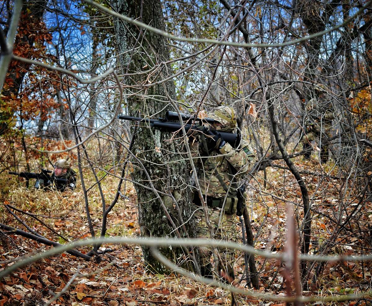 person man aiming rifle military