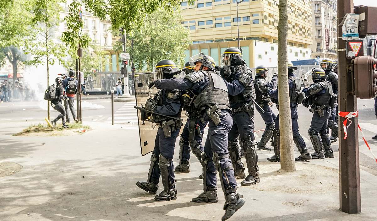 person man holding assault rifle helmet