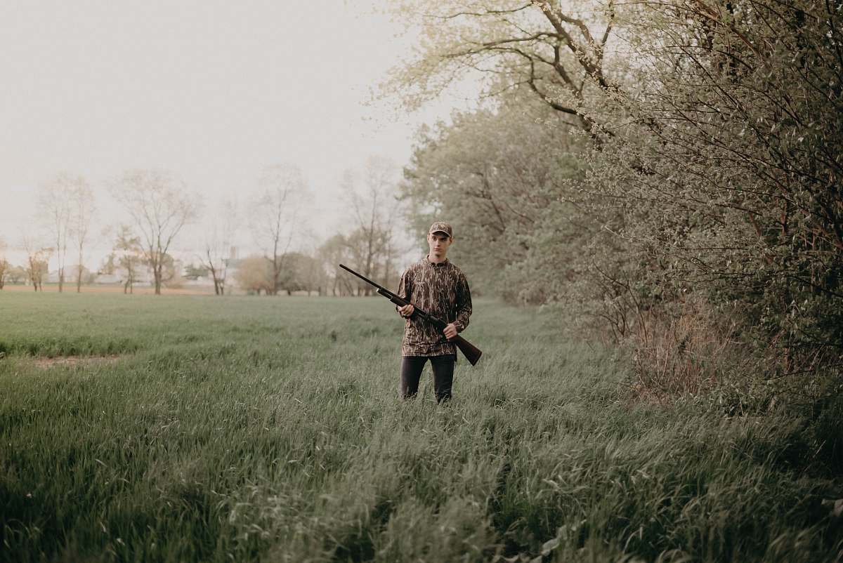 person man holding gun military