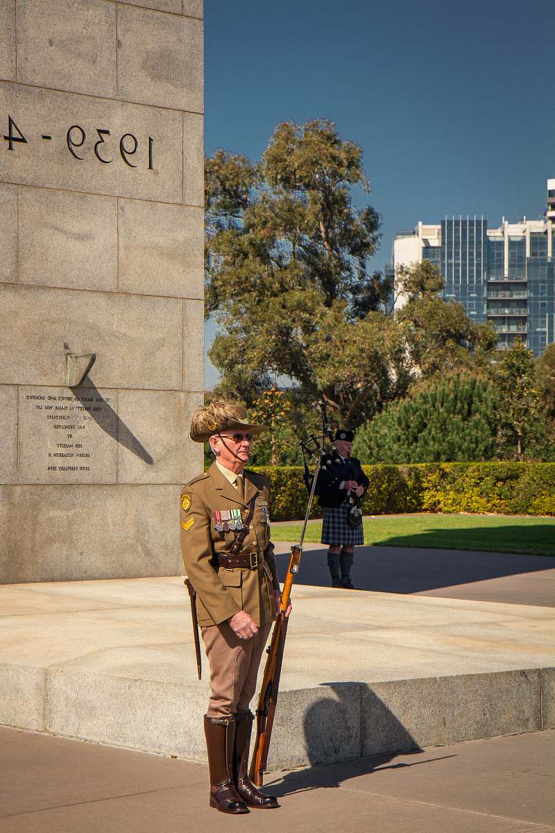 person man wearing bornw military suit military