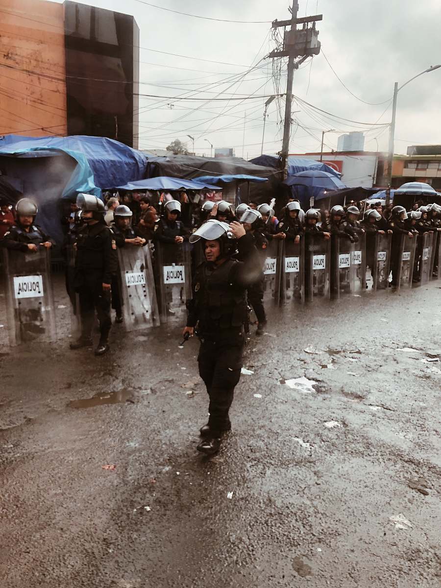 person officer walking on street police