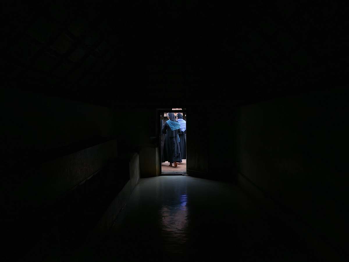 corridor woman wearing blue dress lighting