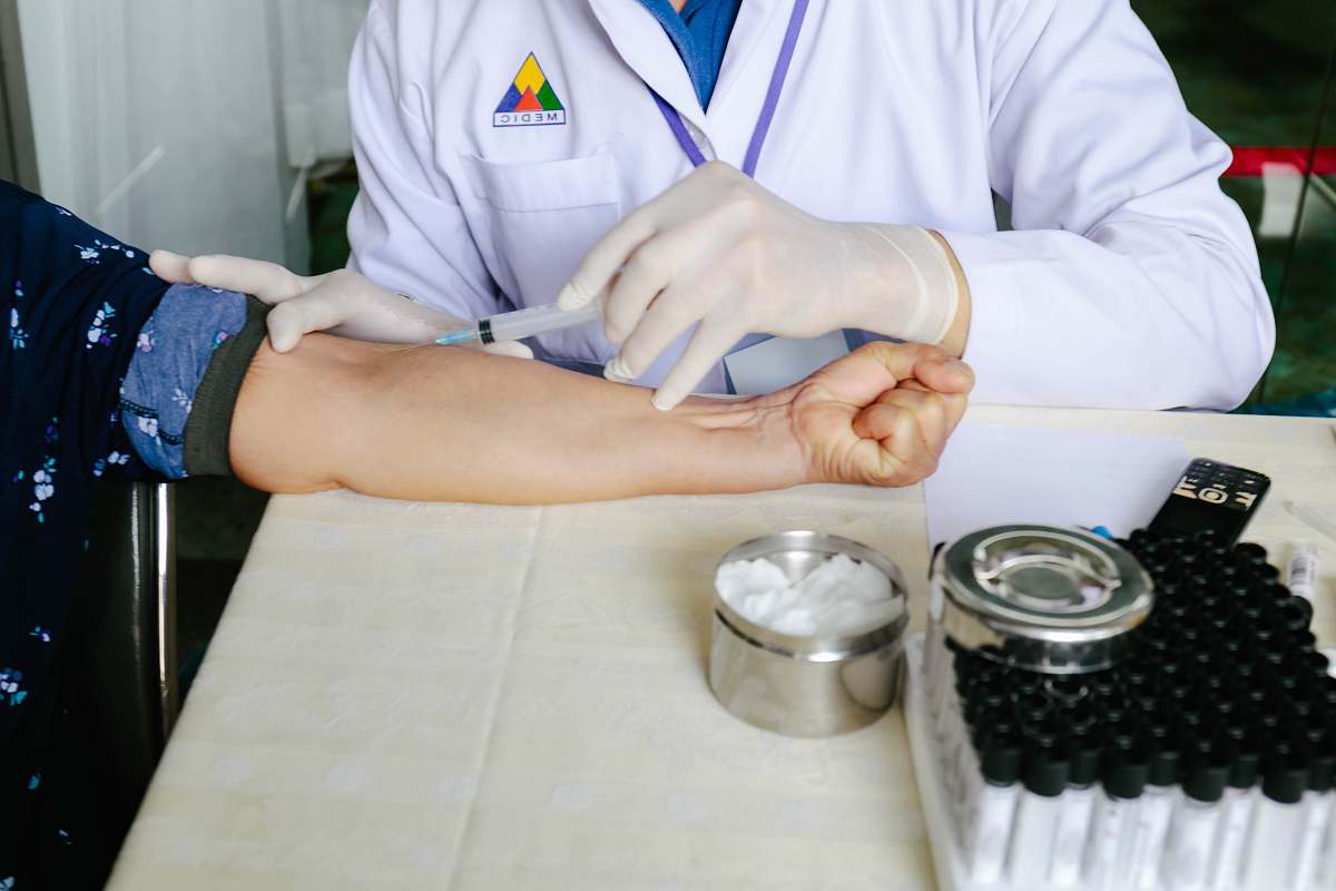 human woman holding syringe person