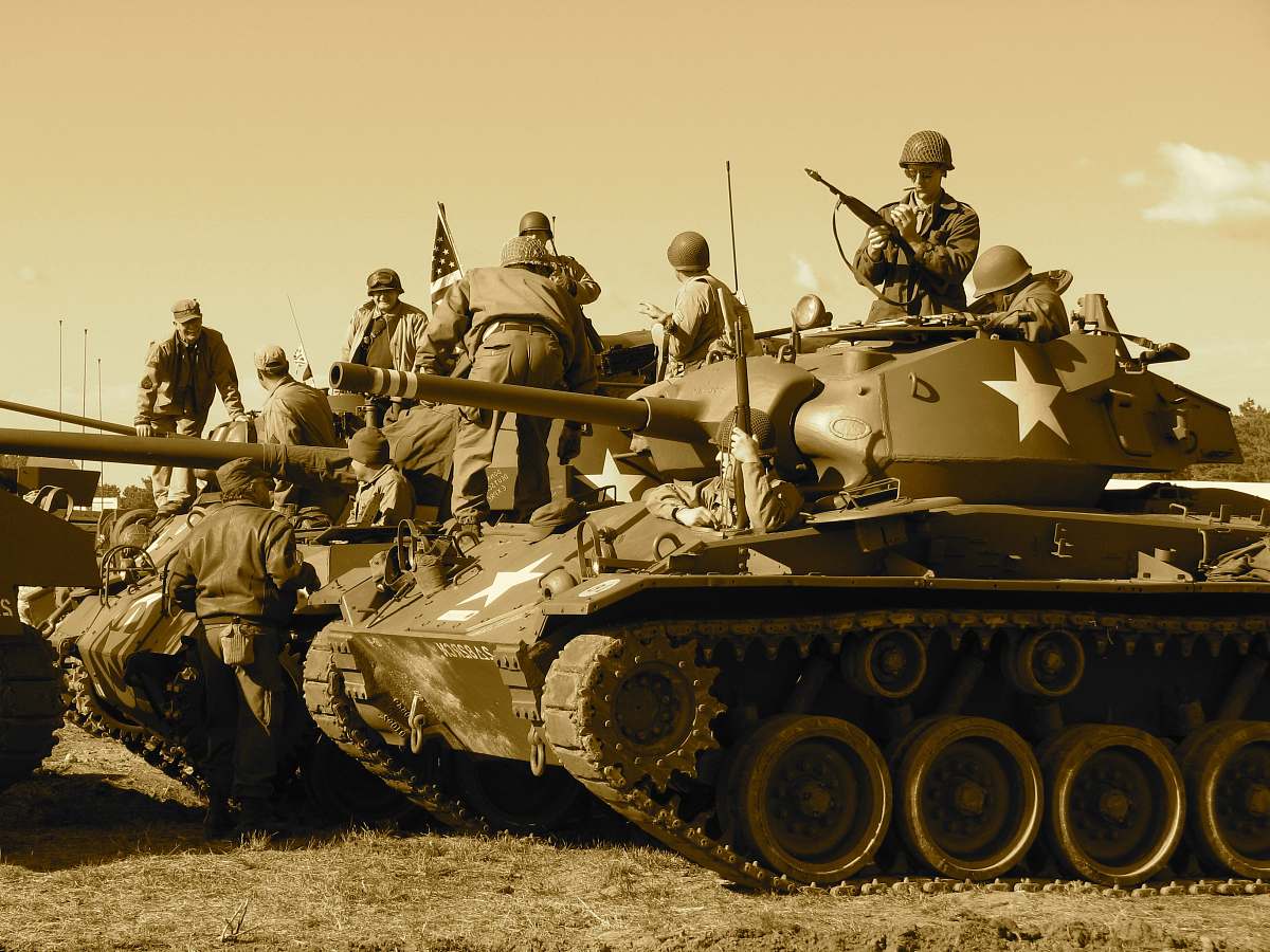 tank people sitting and standing on battle tank army