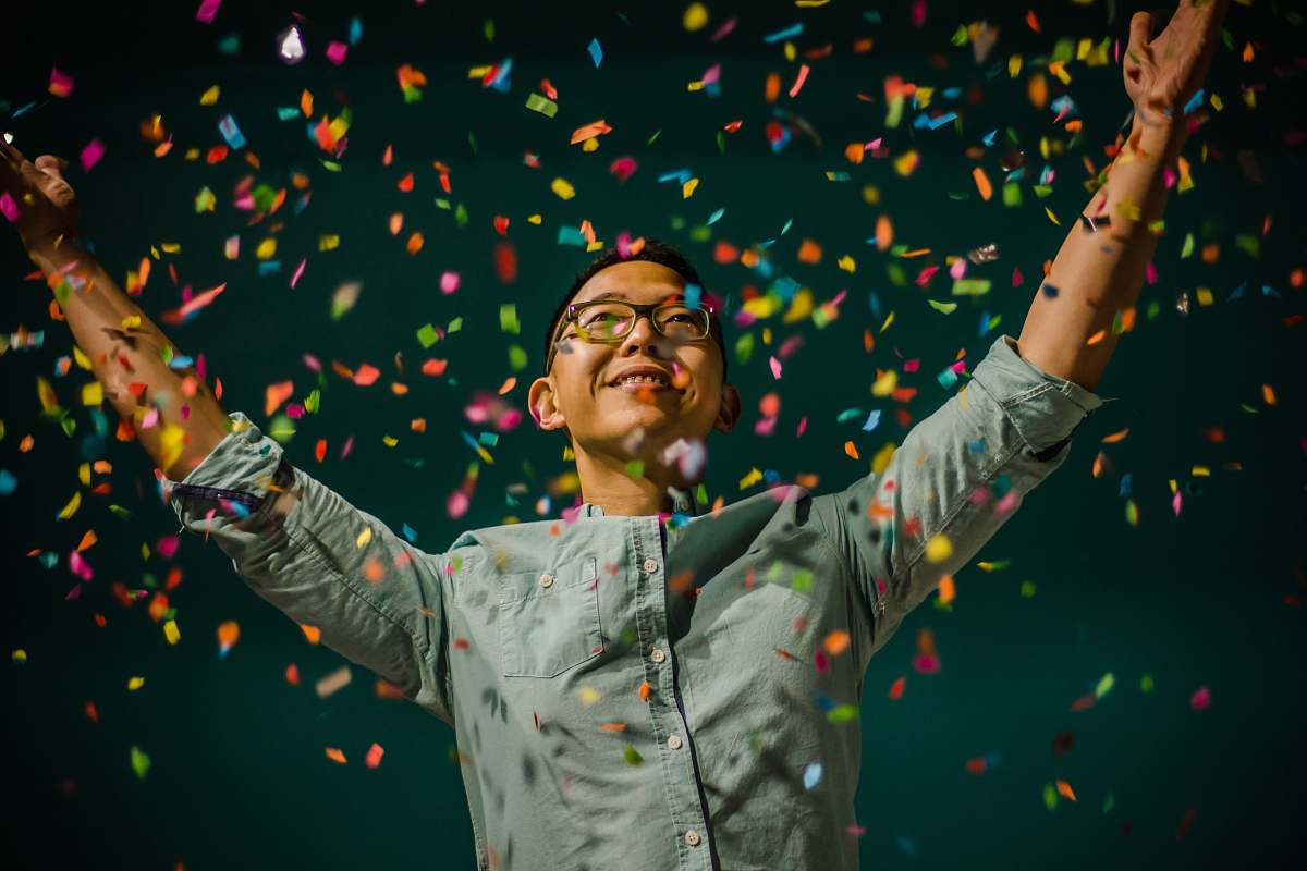 people person throwing confetti confetti