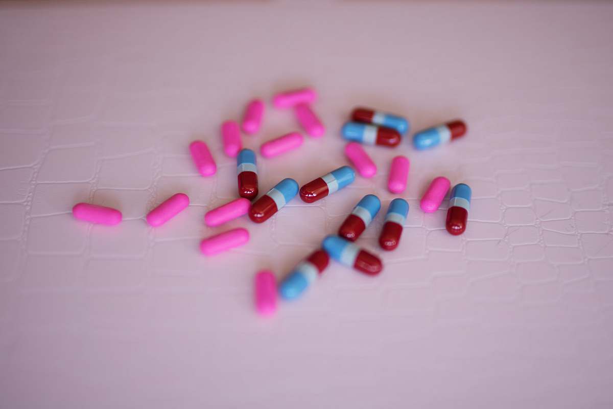 medication capsules on white panel medicine
