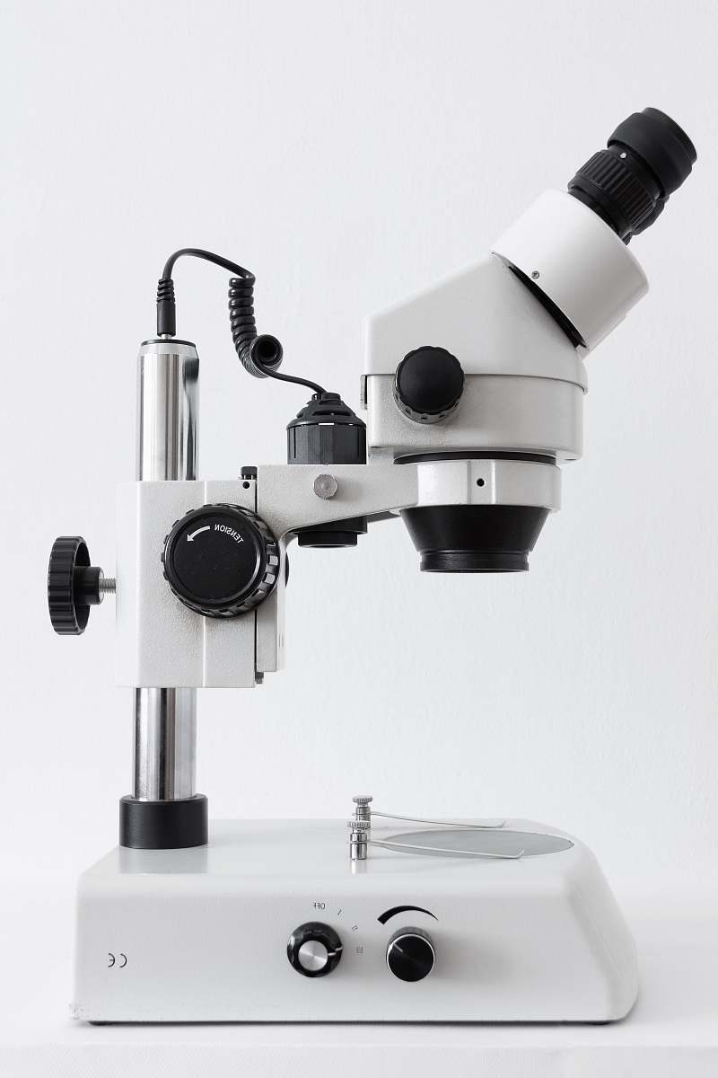 black-and-white white and black microscope on white surface microscope