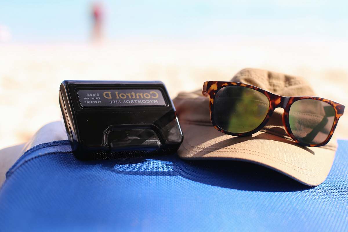 goggles tortoiseshell framed sunglasses near black Control D device taken at daytime glasses