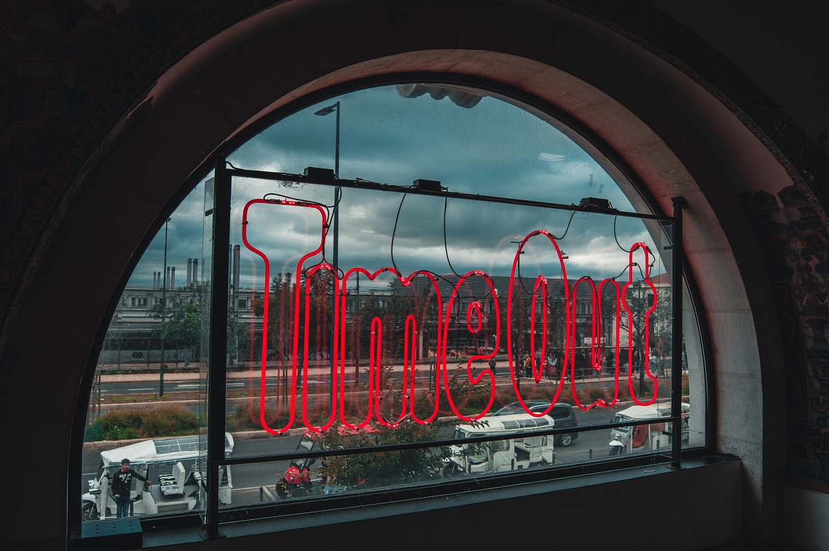 transportation red neon signage placed on window panel vehicle