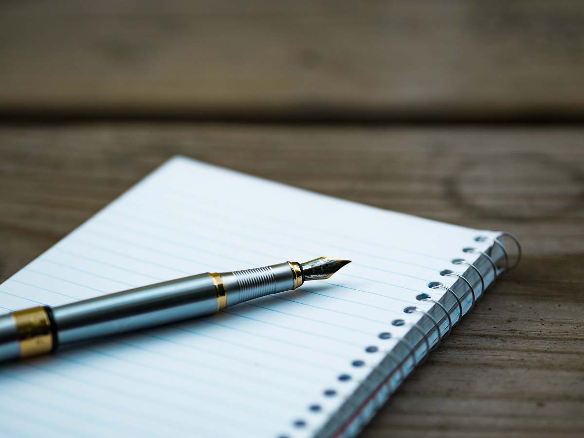 pen fountain pen on spiral book fountain pen