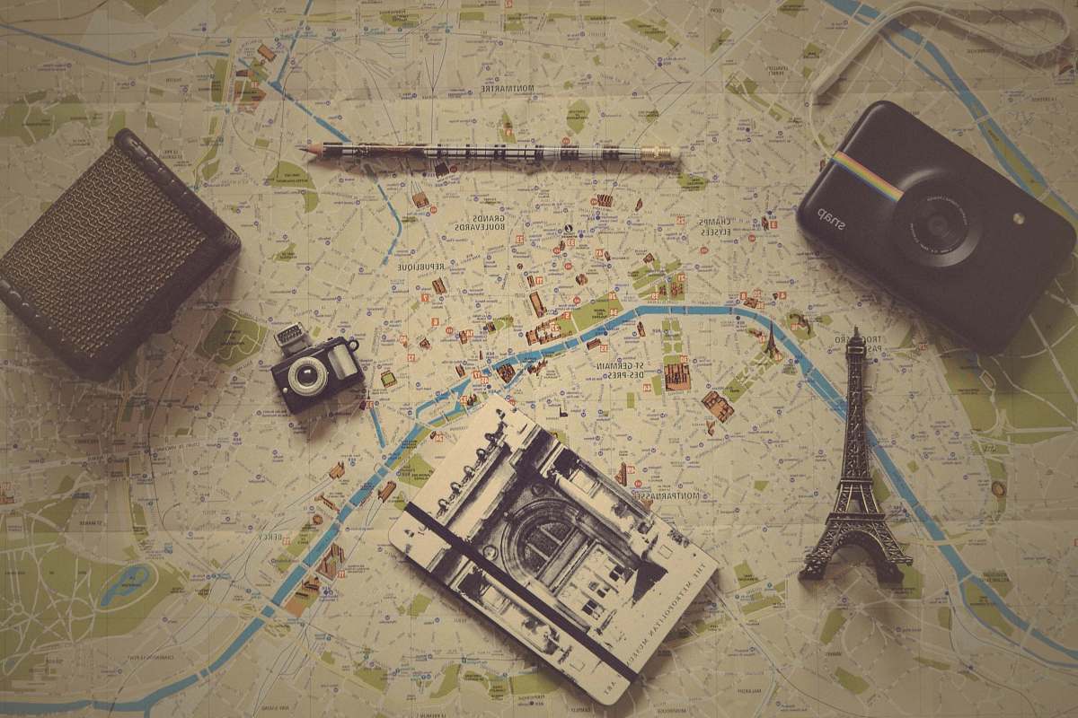 map black camera near gray metal Eiffel tower figurine travel