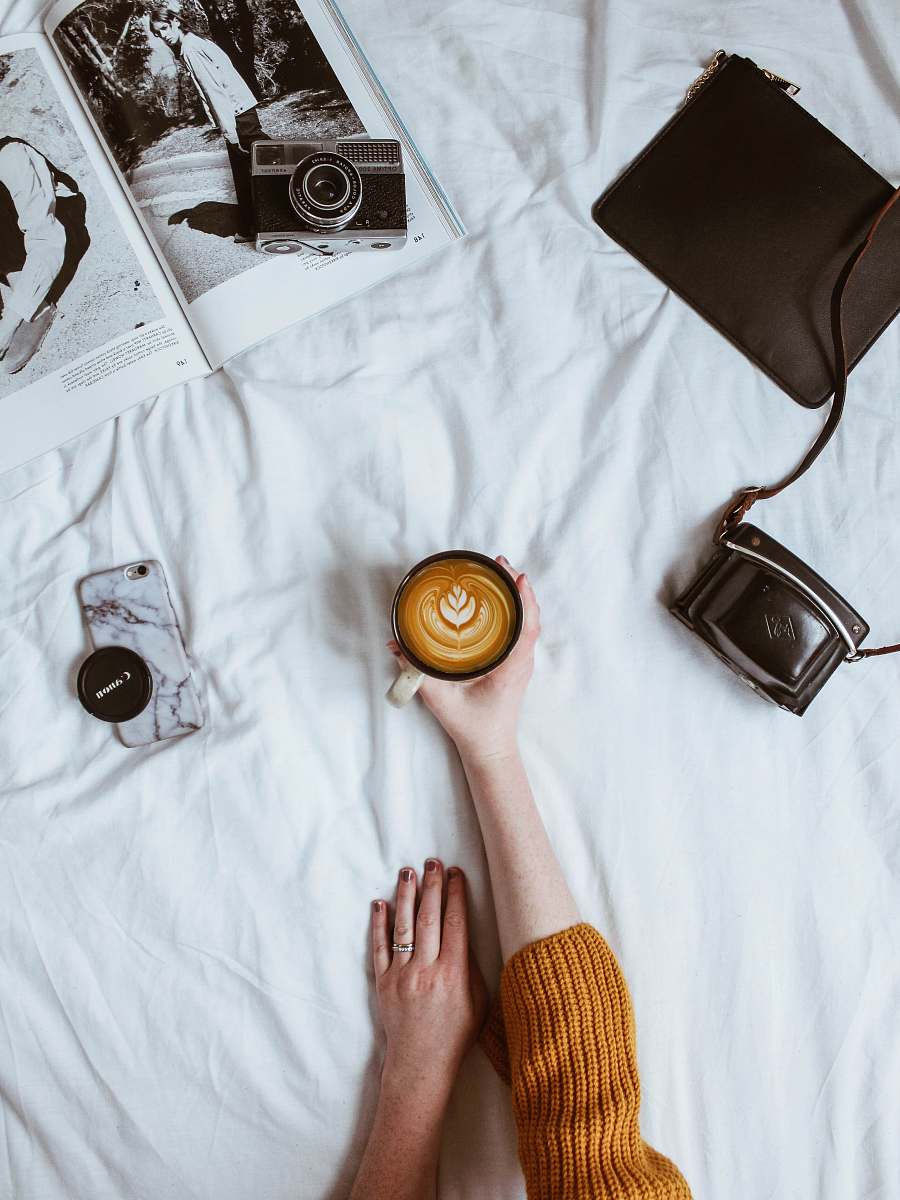 electronics person holding coffee on white glass coffee