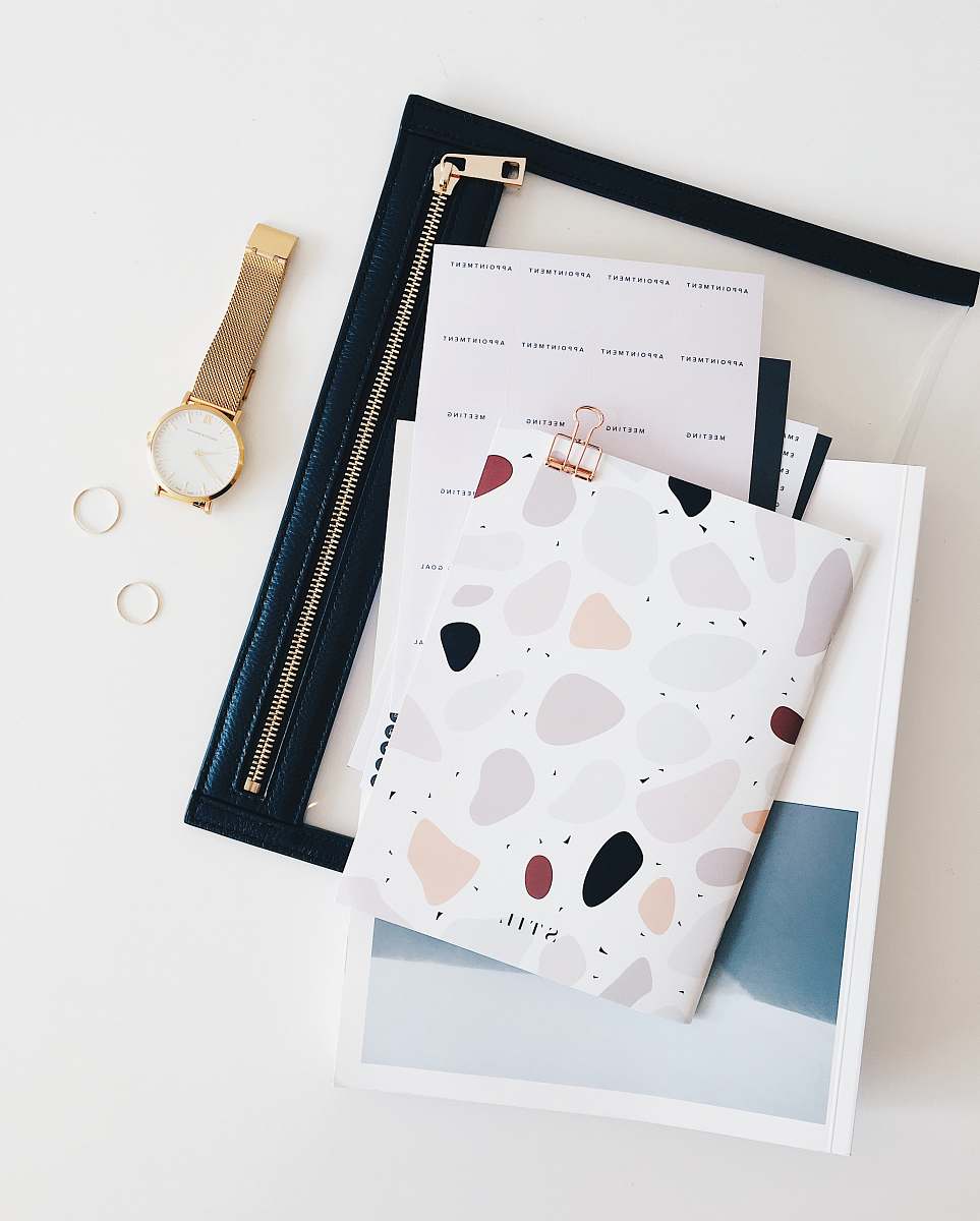 layout round gold-colored analog watch with link bracelet flatlay layour