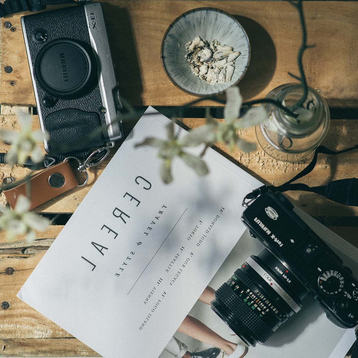 camera white printer paper between two black DSLR cameras cereal