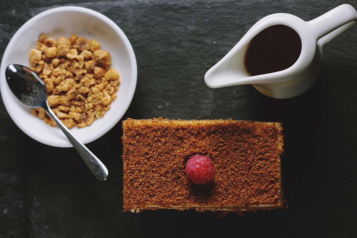 ball Flat lay of breakfast cake, syrup, and hazelnuts sphere