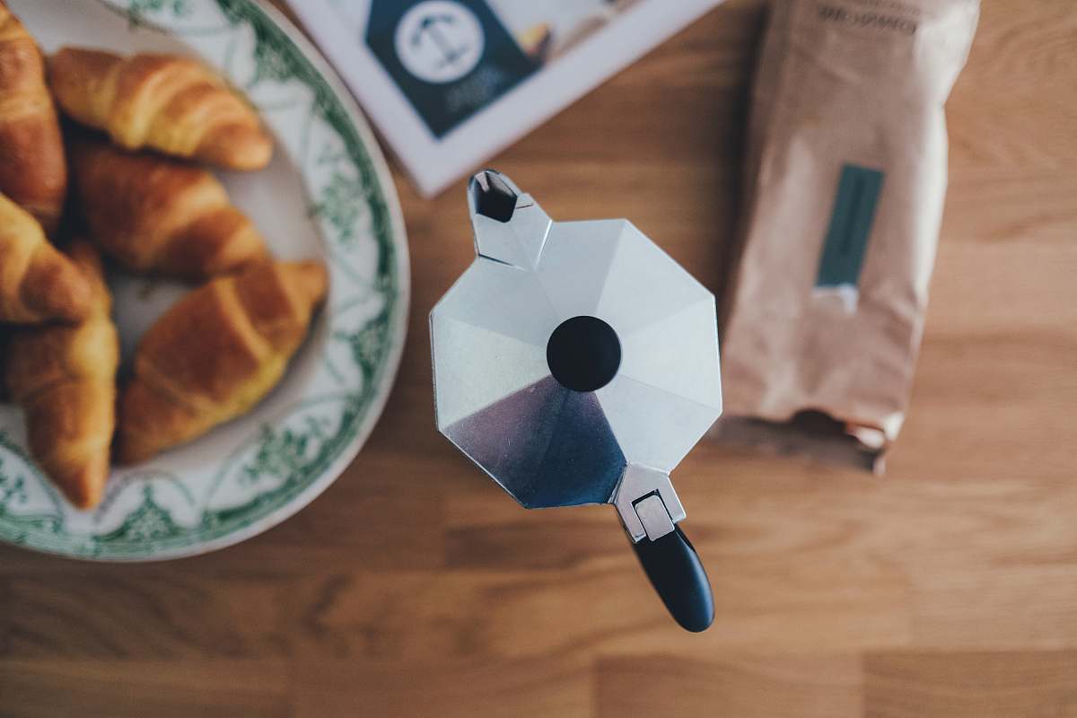 coffee rolled breads on ceramic plate croissant