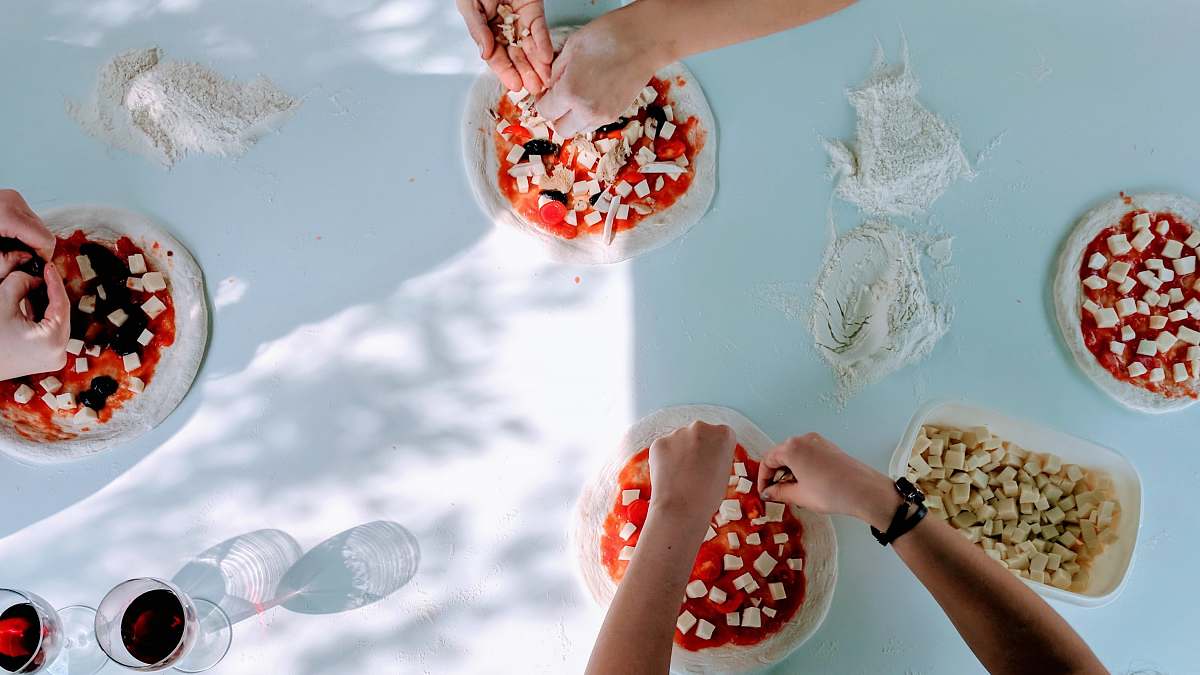 ornament three person making pizza on table ankle