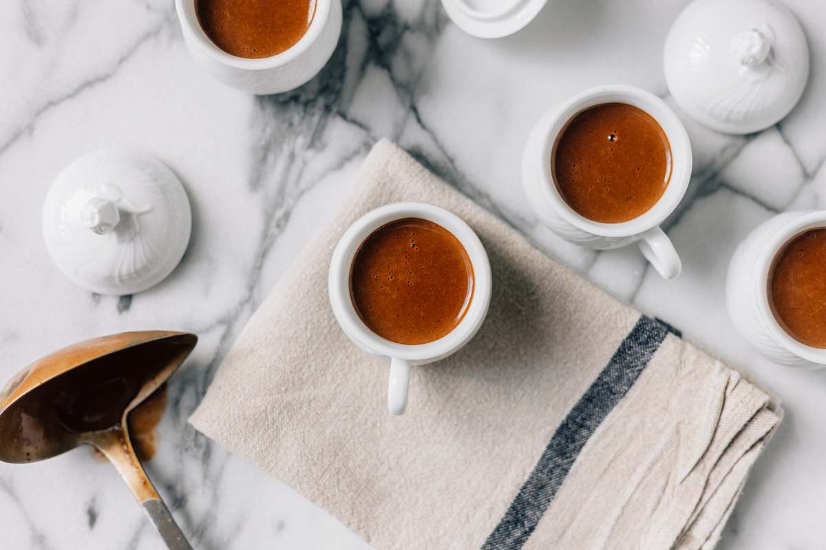 coffee white ceramic teacup filled with red liquid drink