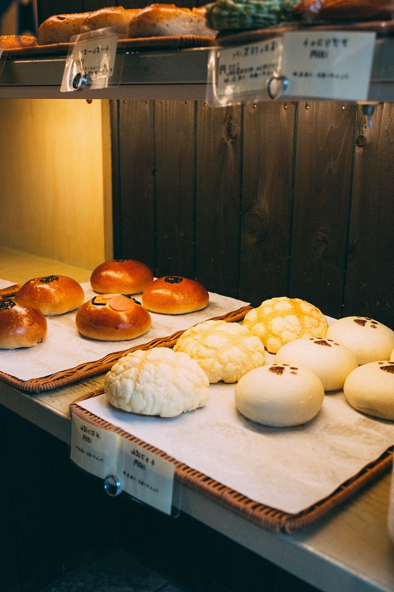 a table with bread and pastries on it