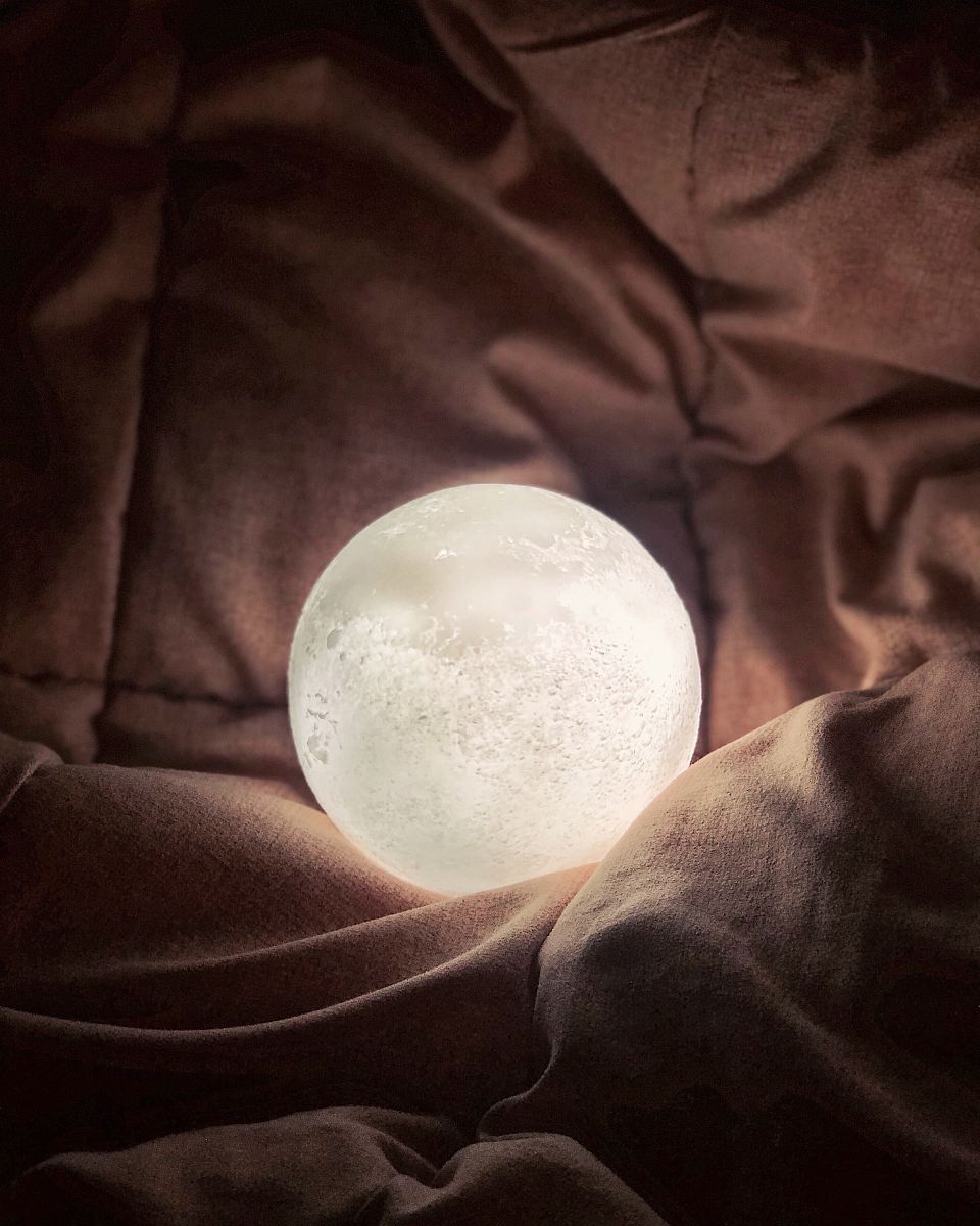 a moon in the dark canvas print