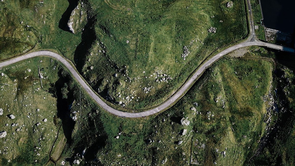 aerial photography of gray spiral road during daytime