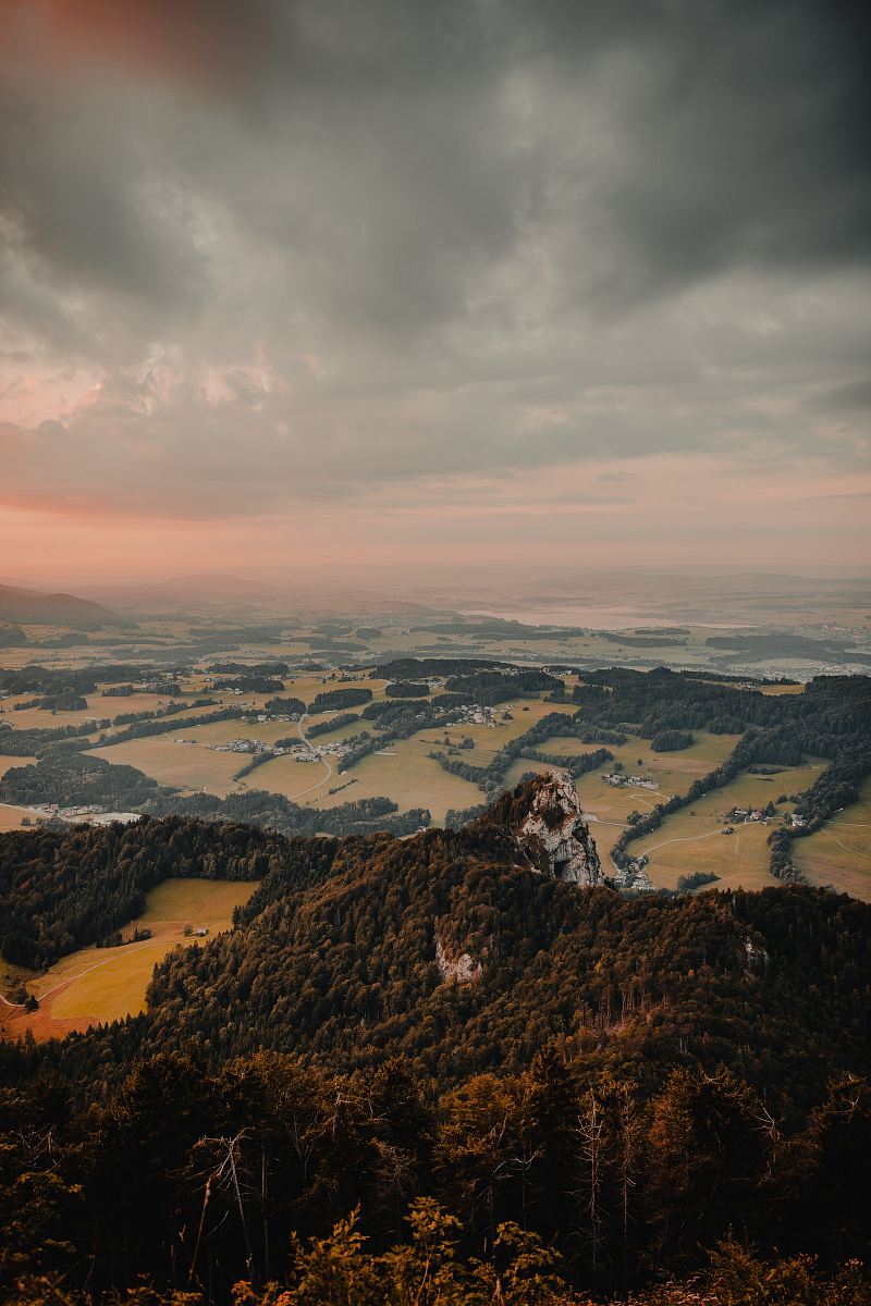 aerial photography of tree covered mountain under gray skies