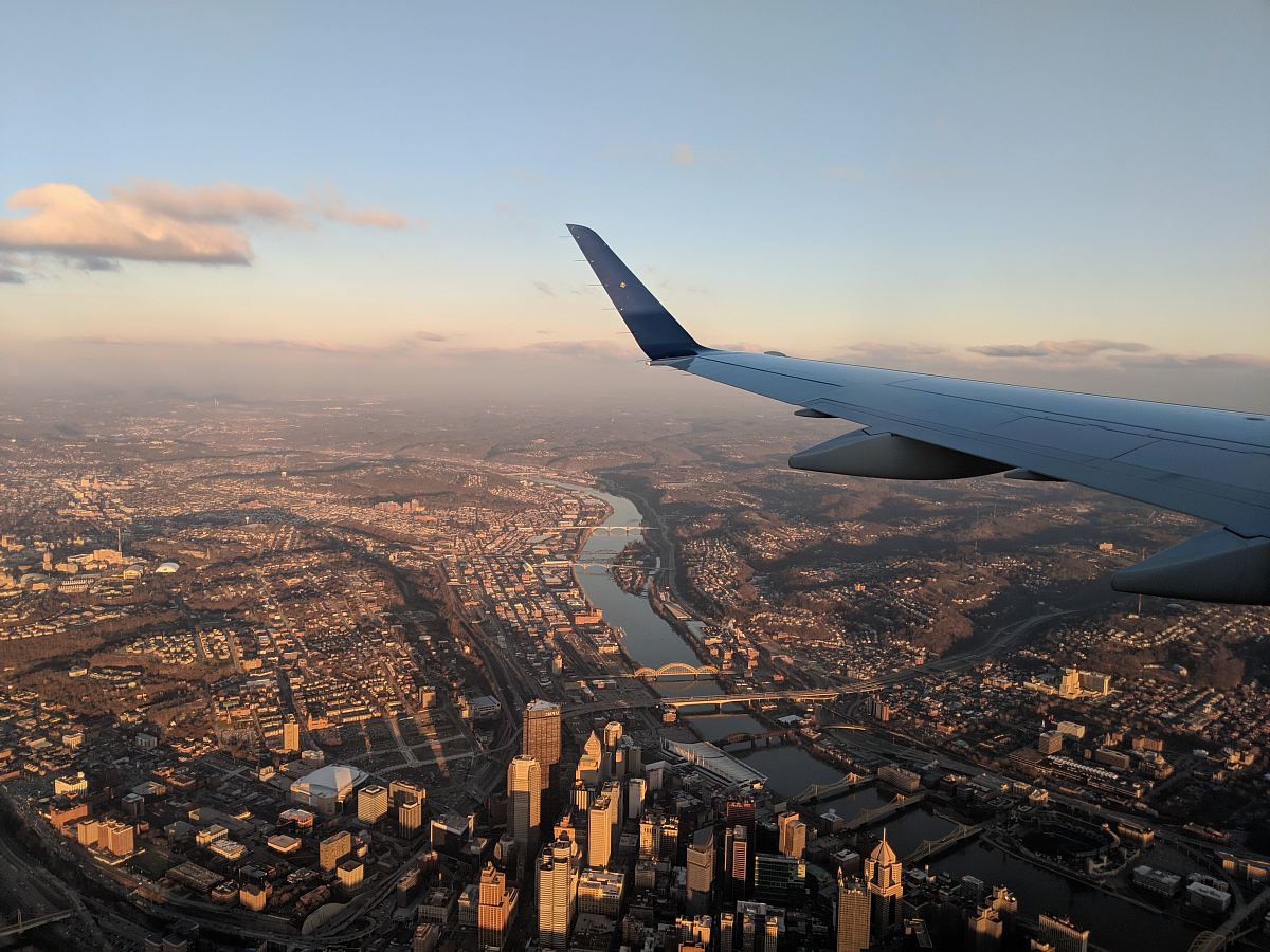 aerial view of body of water between buildings