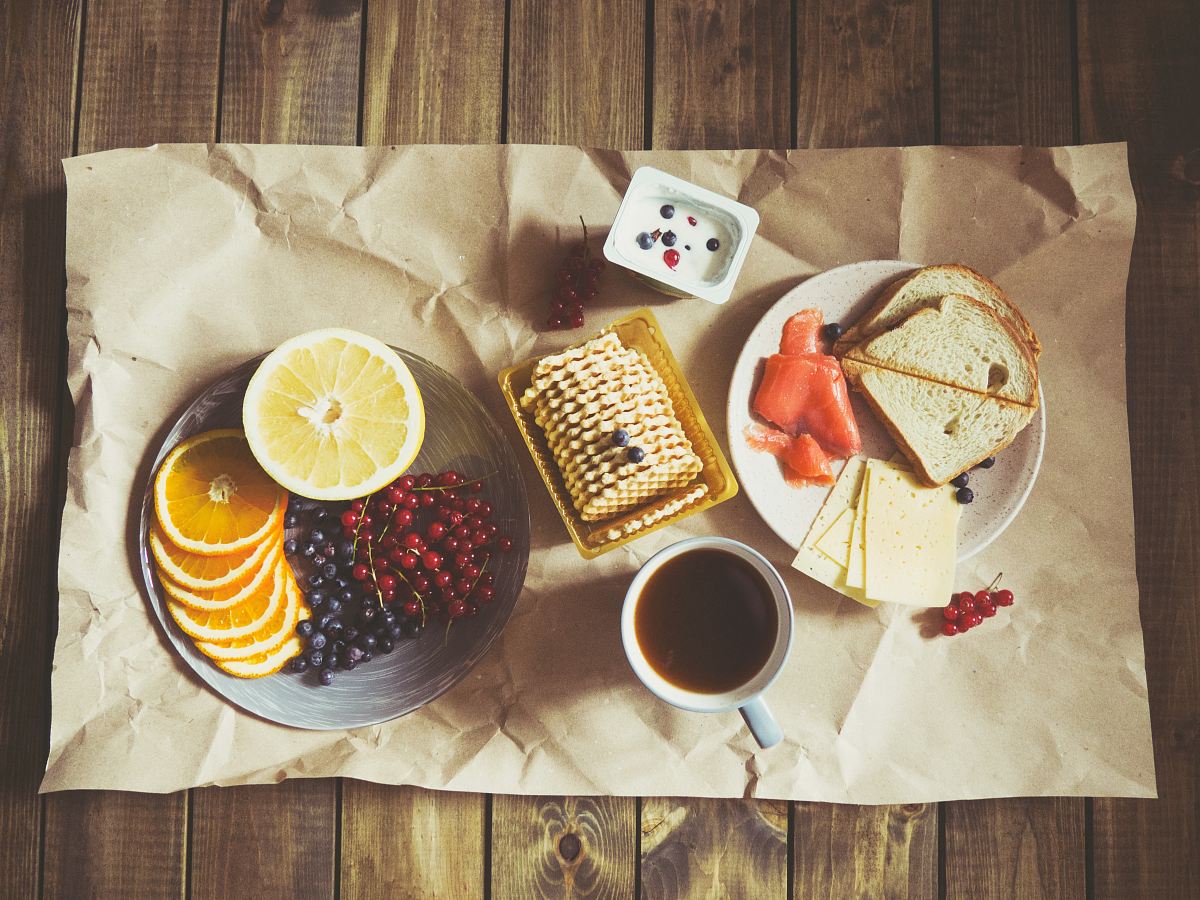 bread and fruits on plate