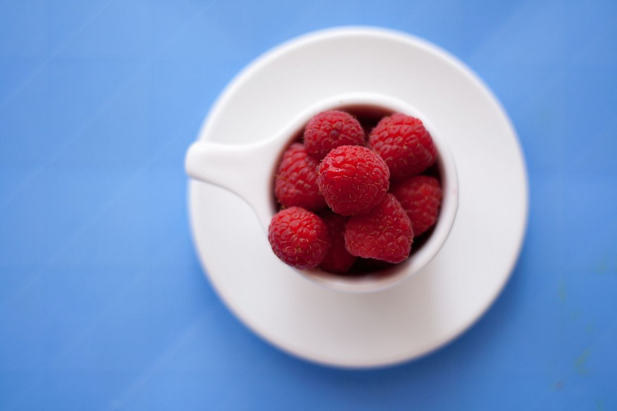cranberries on teacup and saucer