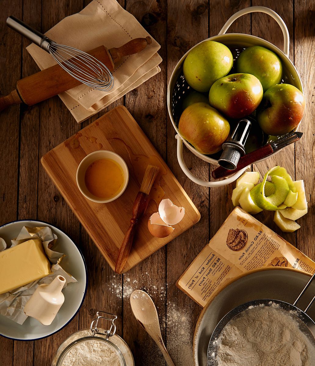 flat lay photography of mug on brown wooden chopping board