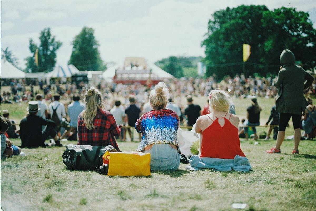 group of people on grass field under sunny day