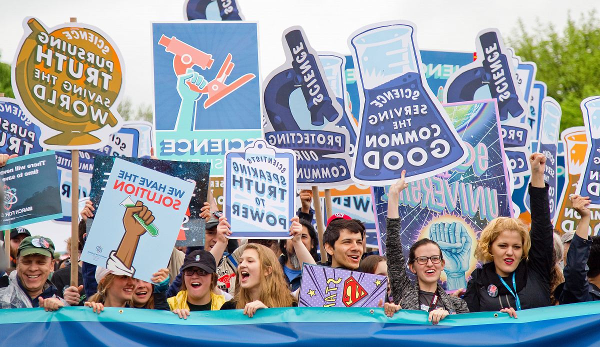 group of people with signages