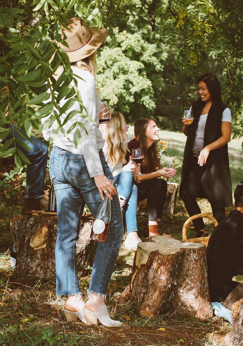 group of women in forest drinking