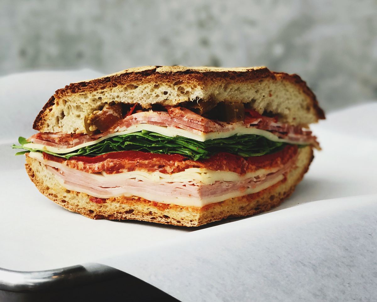 ham sandwich on white surface