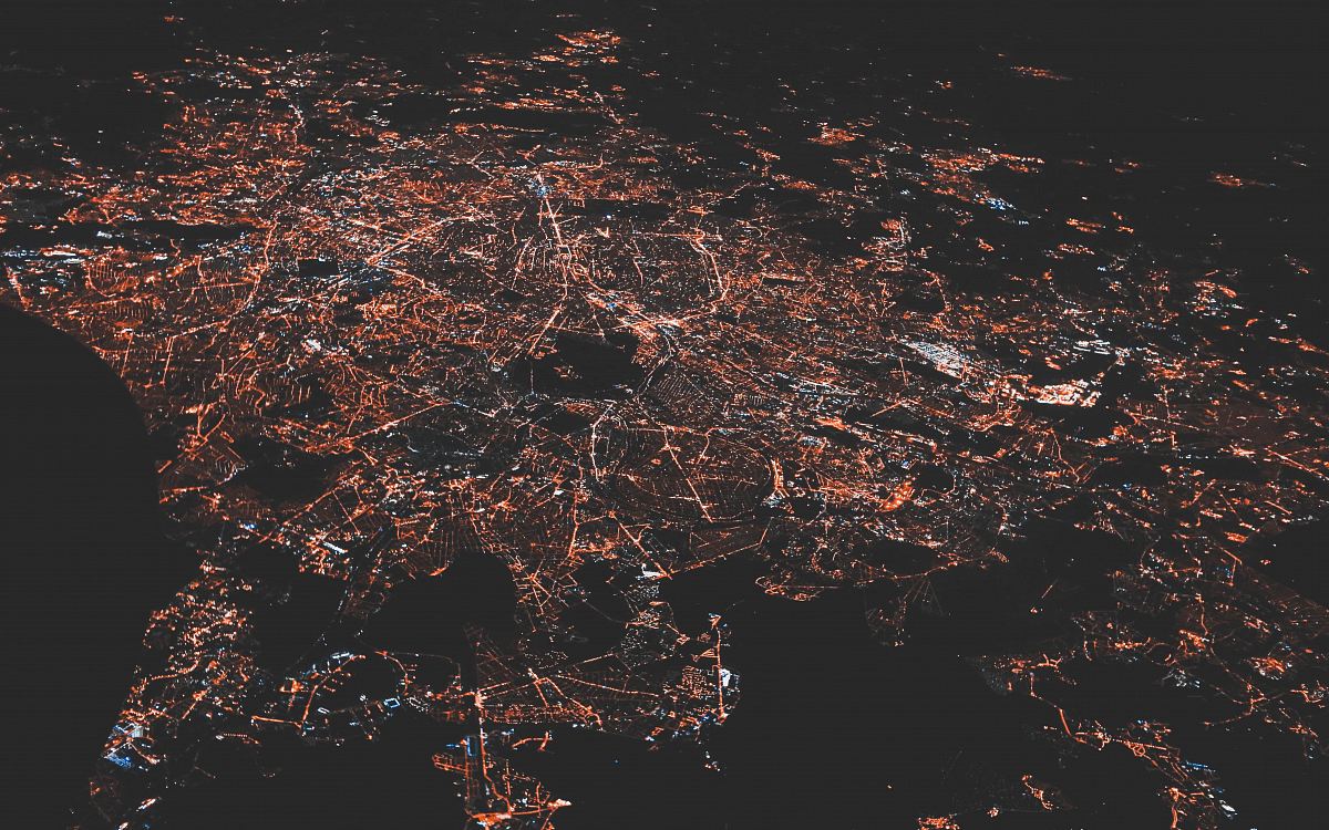 lighted city at night aerial photo