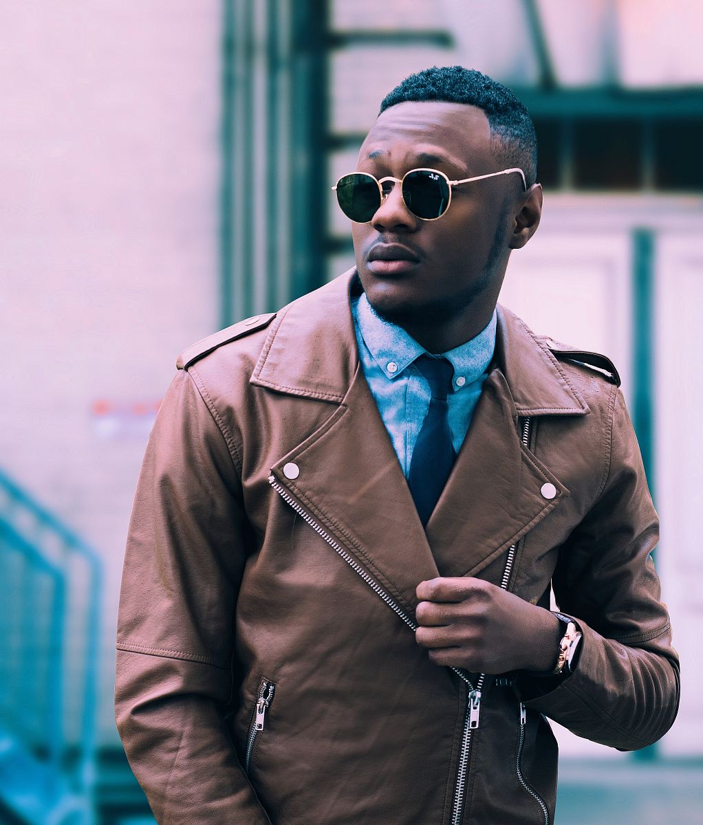 man in brown leather coat