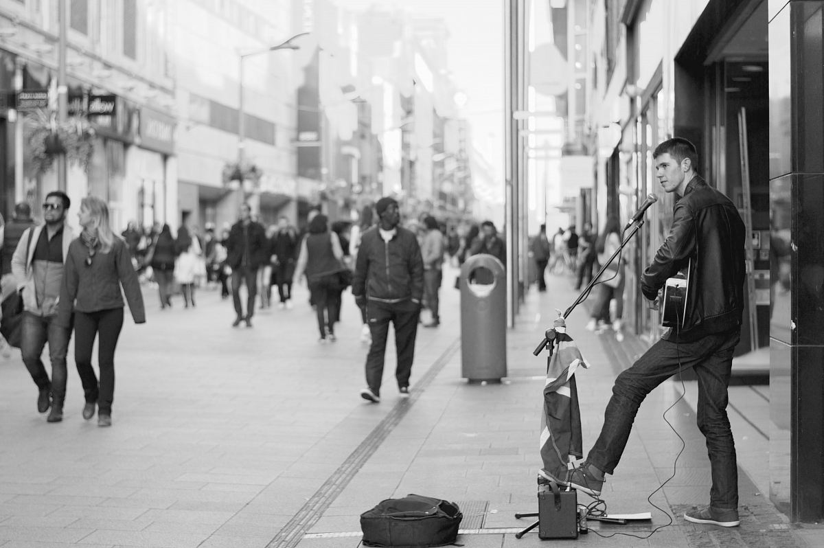 man playing musical instrument at town